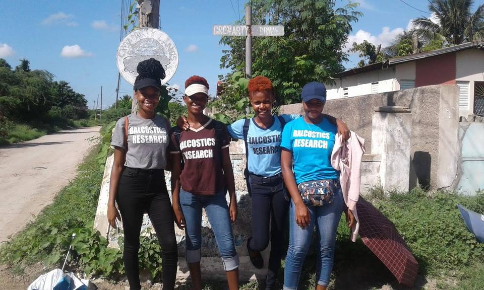 Four Balcostics Research interviewers on a country road before door-to-door fieldwork